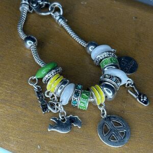 Jewelry Nexus Peace green yellow silver themed charm bracelet preowned